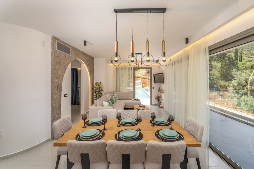 Open plan fully equipped kitchen - living area with direct access to the pool.