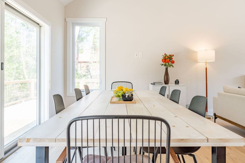 Dining area with ample seating for all as well as deck access