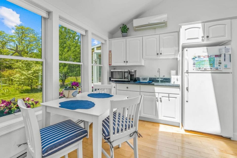 Your private kitchenette with a Keurig & K-cups, fridge, microwave, toaster, all the dish ware and utensils you'd need, lots of natural light, and seating for 3 at the dining table.