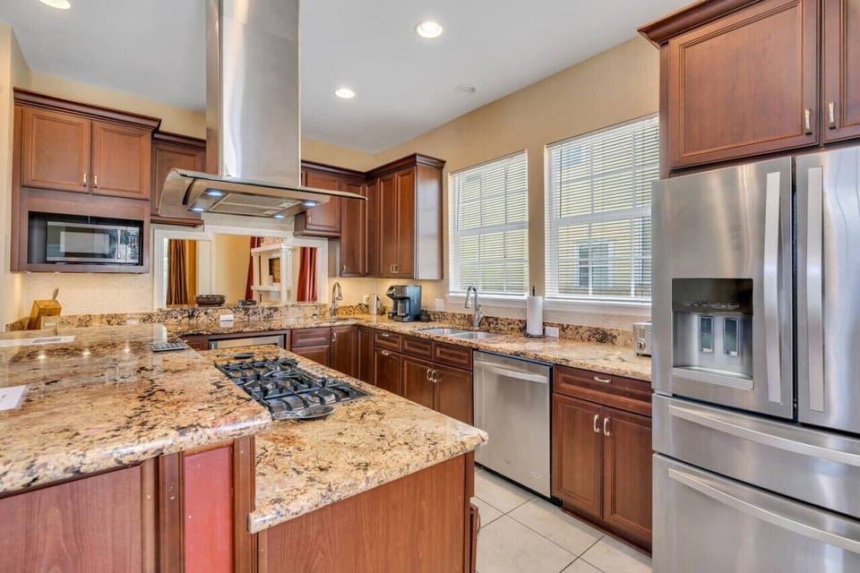 Fully-equipped kitchen w/ gas stove and stainless steel appliances