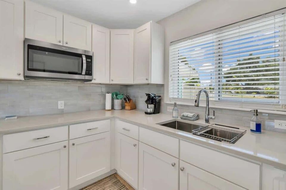 Studio Kitchen with Microwave and Kitchen Supplies