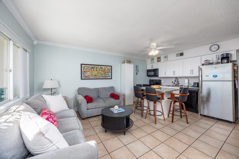 Open concept living area with 2 couches for ample seating and TV