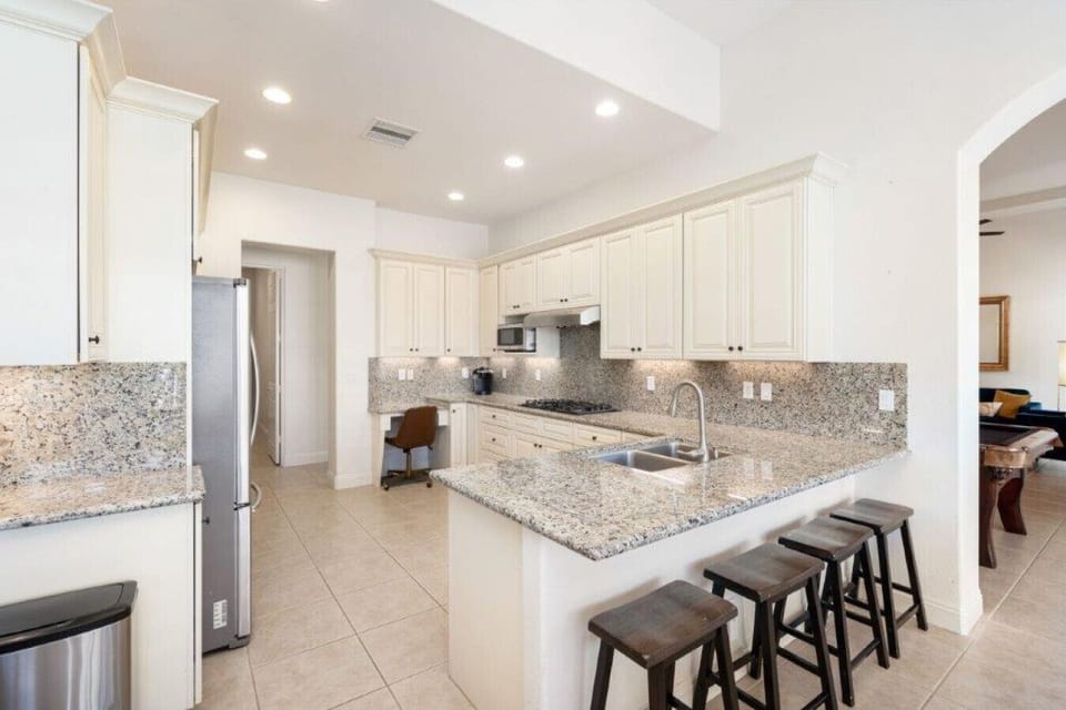 Bright and spacious kitchen with island and bar seating