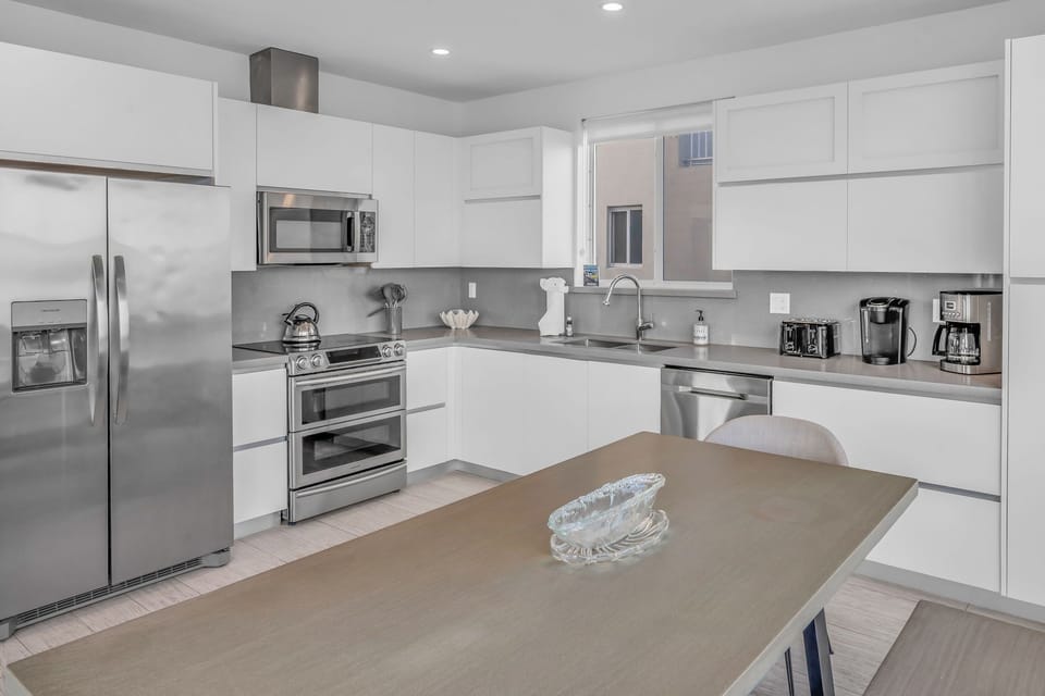 Kitchen - fridge microwave and stove
