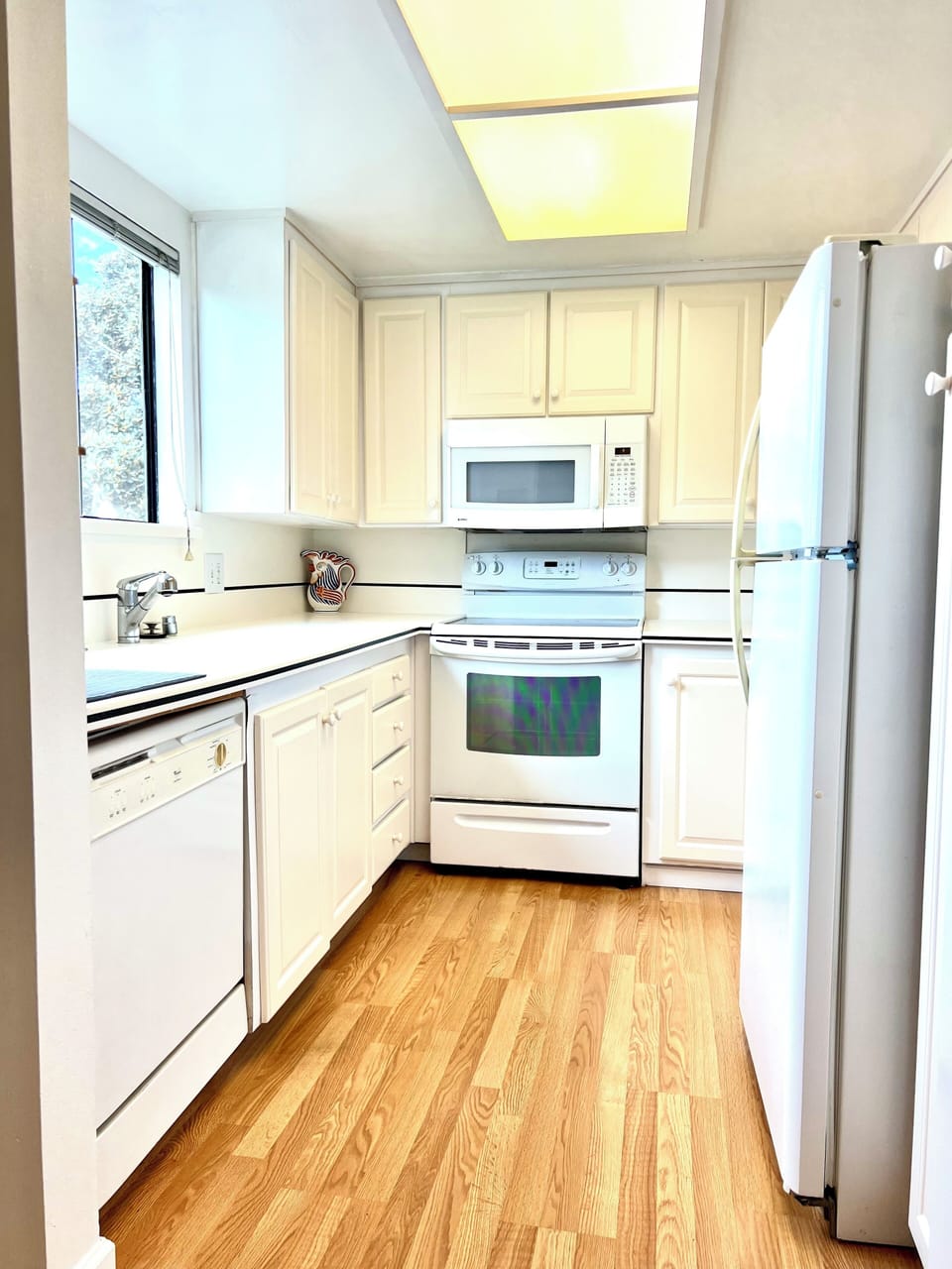 Fully equipped kitchen with views toward La Jolla and North Pacific Beach.