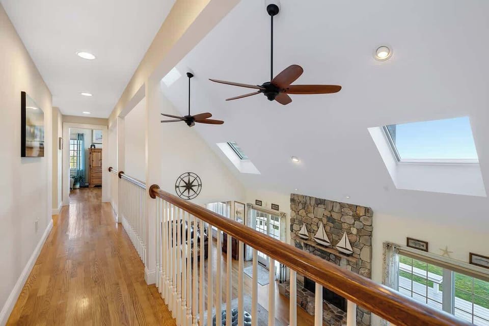 Hallway overlooking the open concept living space 