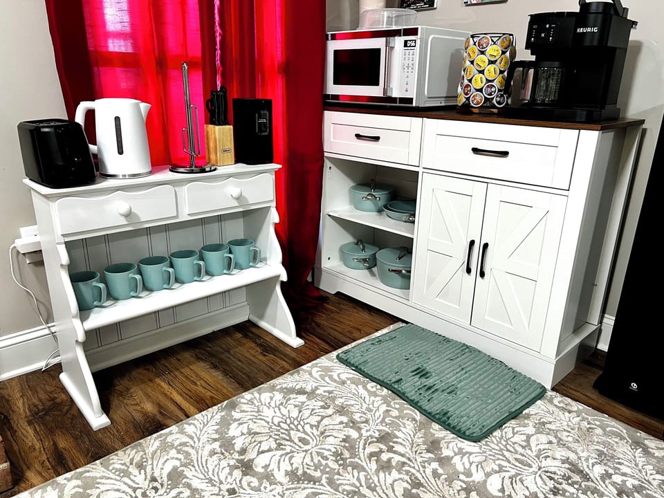 Private kitchenette with microwave, coffee maker, hot water, toaster. 