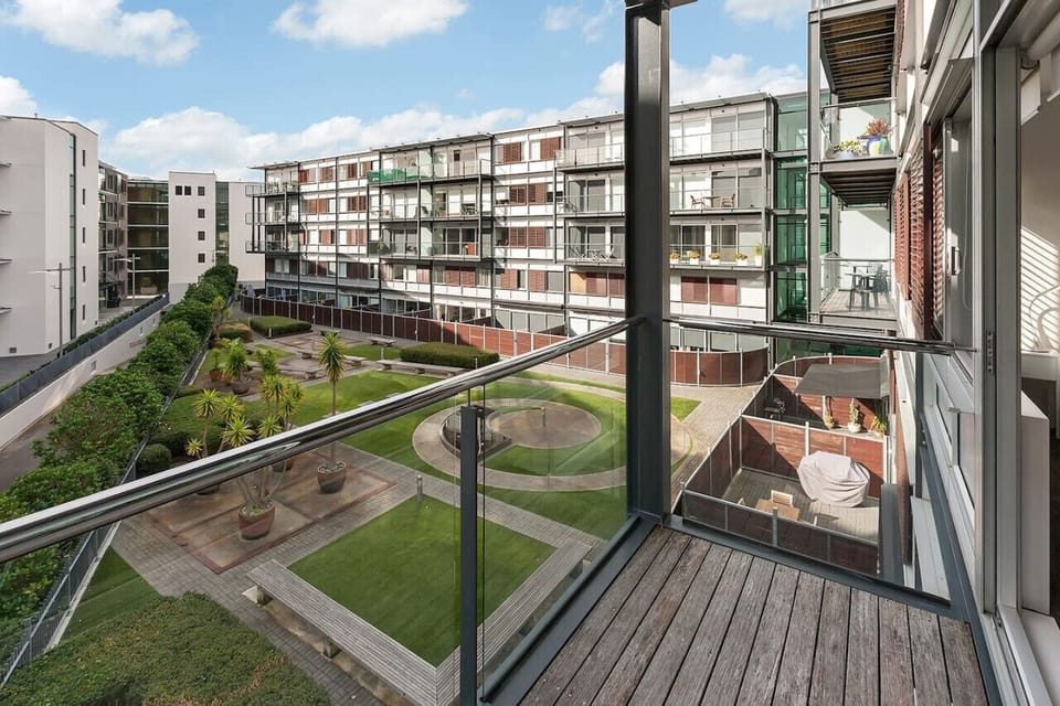 Enjoy breathtaking views of the lush courtyard from your private balcony, the perfect spot to unwind.