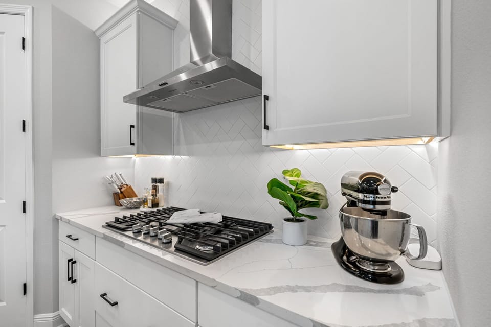 Smooth granite countertops stretch elegantly across the space.
