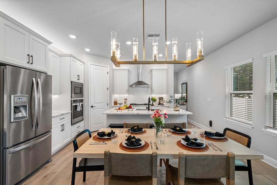 The dining area is a beautifully designed space that exudes warmth and sophistication, perfect for creating memorable moments with family and friends.