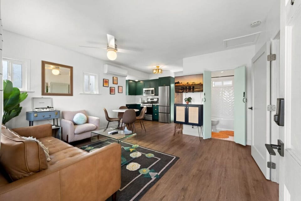 Open living room w/ comfy seating, wood floors & an easy flow for relaxing or gathering.
