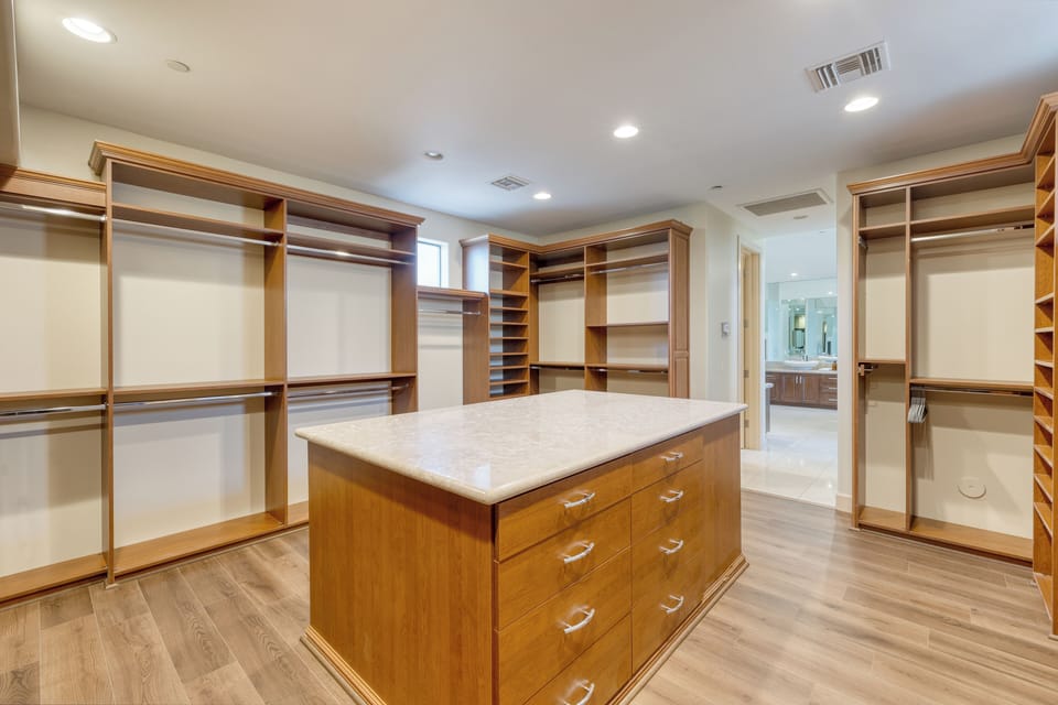 Primary bedroom's large walk-in closet.