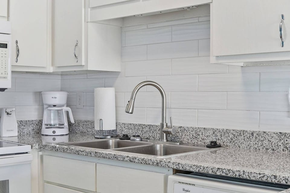 Granite countertops with tile backsplash