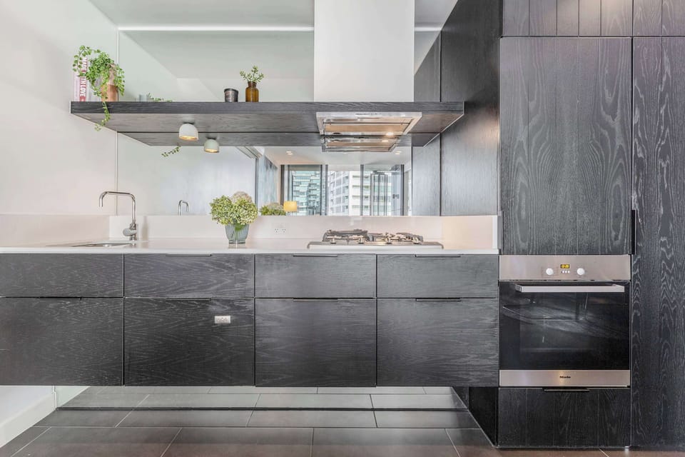 KITCHEN: Sleek lines and modern finishes create a space as functional as it is refined, fully equipped to suit every cooking occasion.
