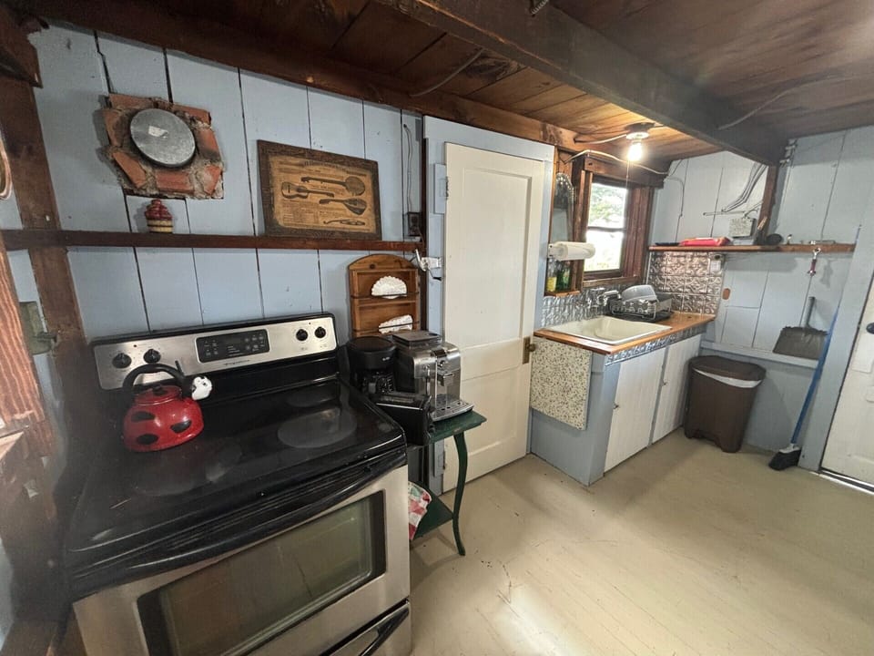 Kitchen with door to the 3/4 bathroom