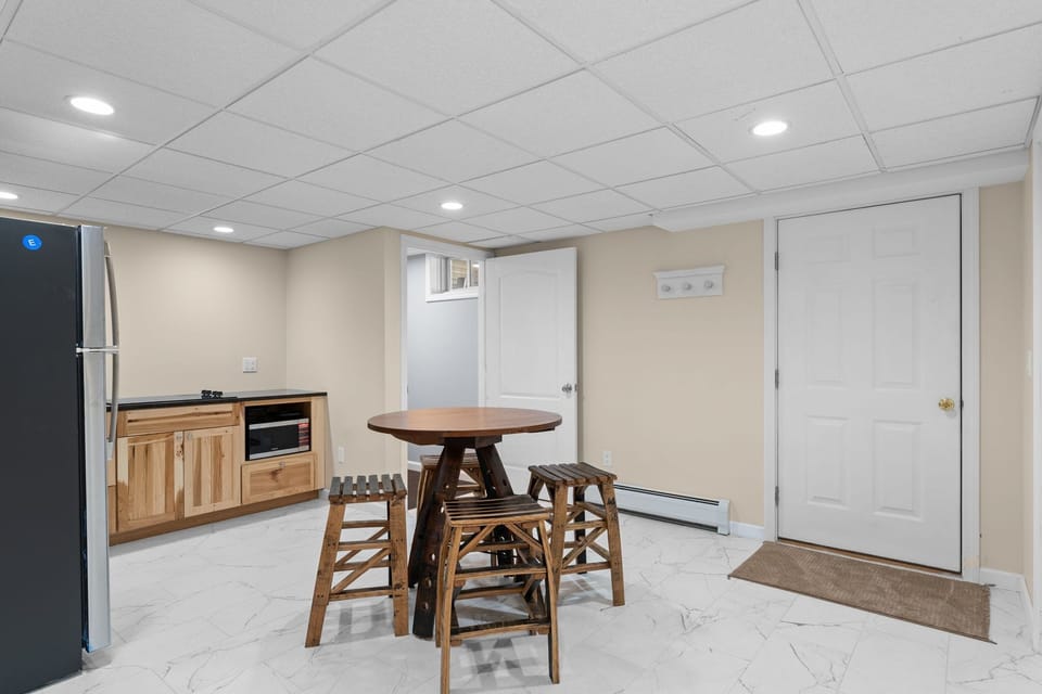 Kitchenette: The door to the right is the entrance from the outside. The door to the left leads to the living room, gym, two bedrooms, and second bathroom.
