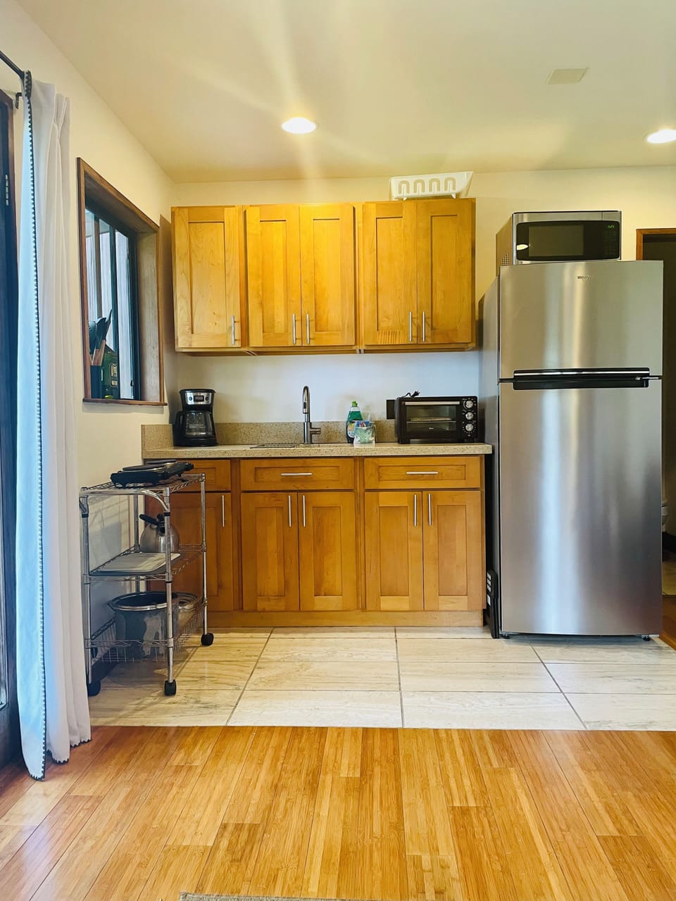 Kitchenette which is open to living room.