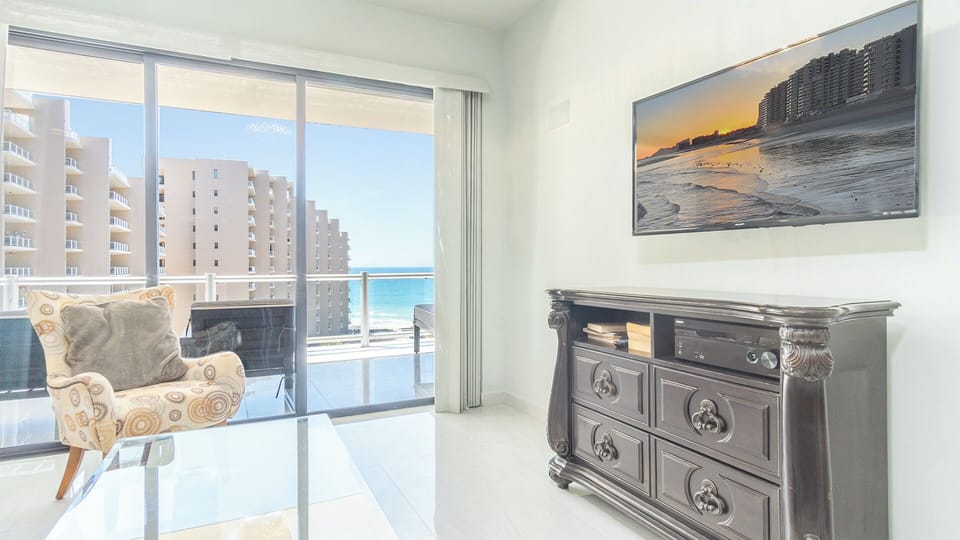 TV and balcony access in the living room.