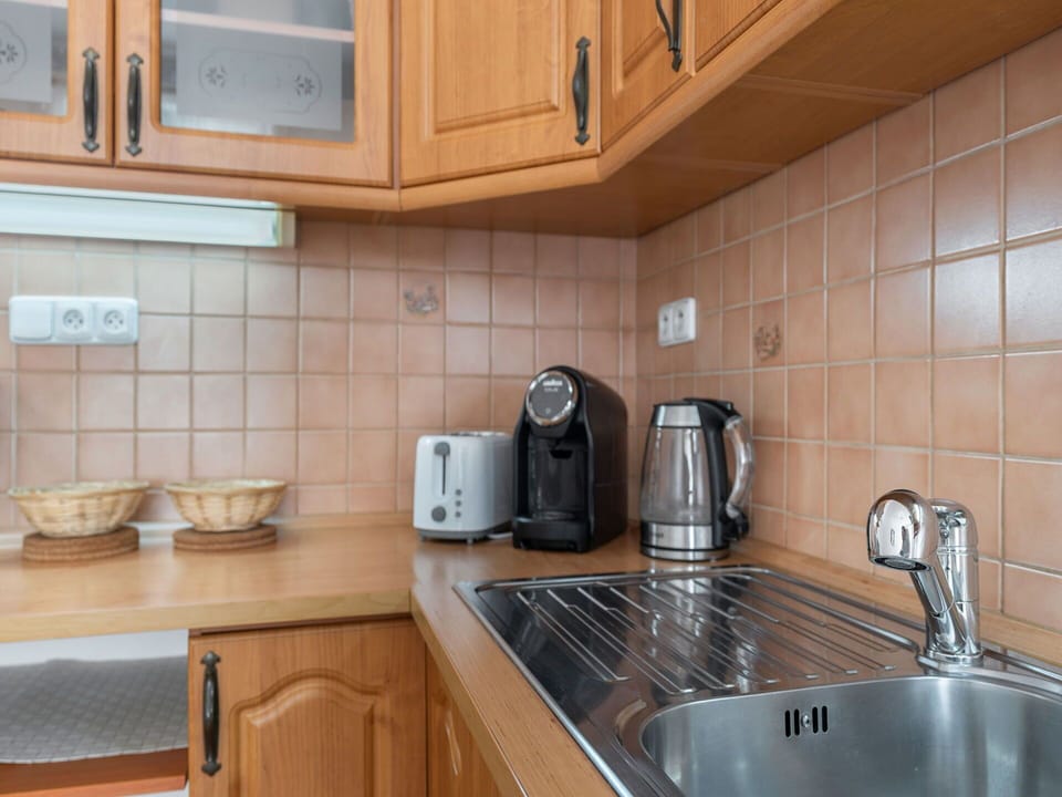 Countertop, Plumbing Fixture, Kitchen, Cabinetry, Kitchen Appliance, Wood, Flooring, Sink, Interior Design, Tap