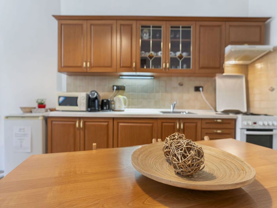 Furniture, Cabinetry, Countertop, Kitchen, Kitchen Appliance, Wood, Interior Design, Flooring, Major Appliance, Cupboard