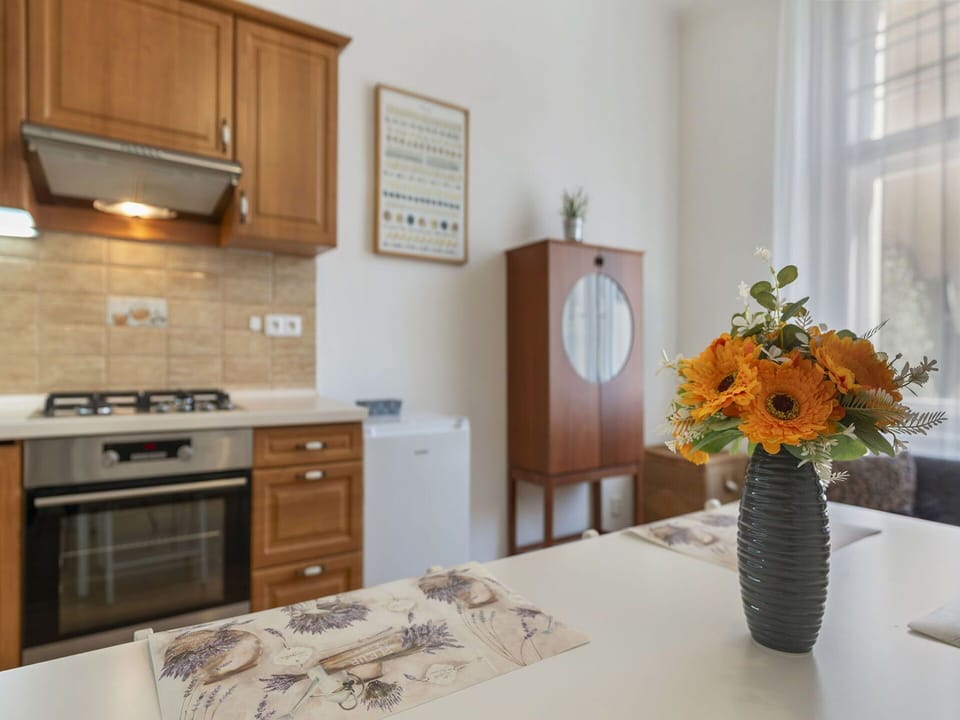 Furniture, Interior Design, Flooring, Cabinetry, Wood, Countertop, Floor, Kitchen Appliance, Room, Kitchen