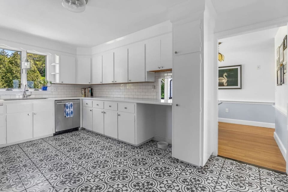Full kitchen with brand new appliances & all the utensils / dish ware you might need to share a meal at home.