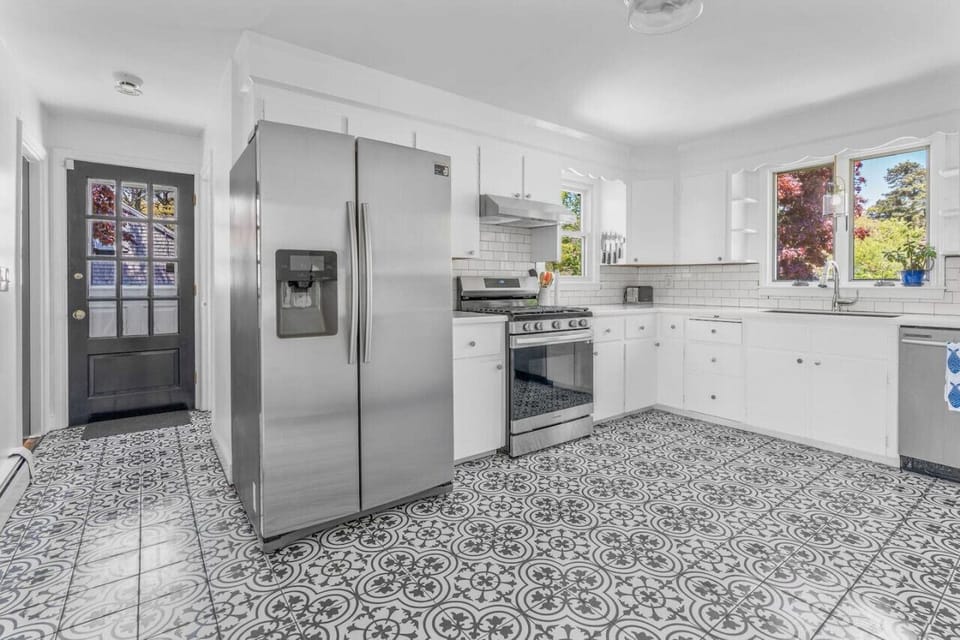 Full kitchen with brand new appliances & all the utensils / dish ware you might need to share a meal at home.