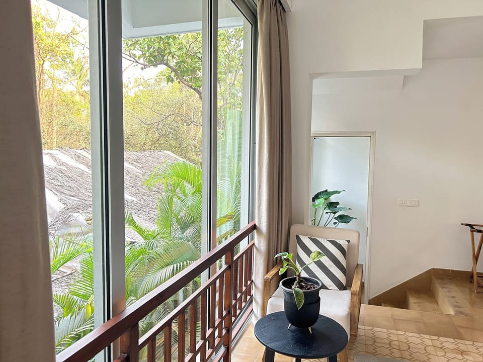 comfortable seating in the master bedroom facing the forest