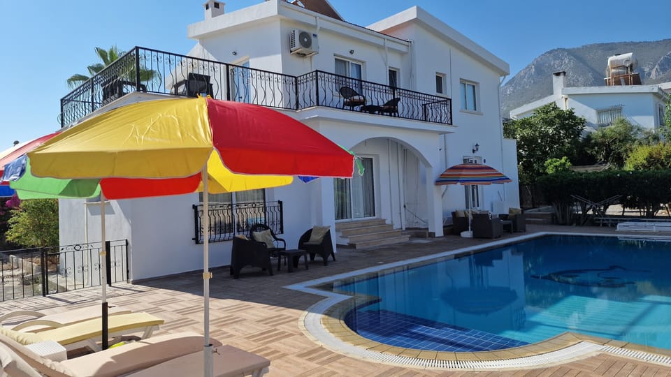 View of villa rear, pool and mountains