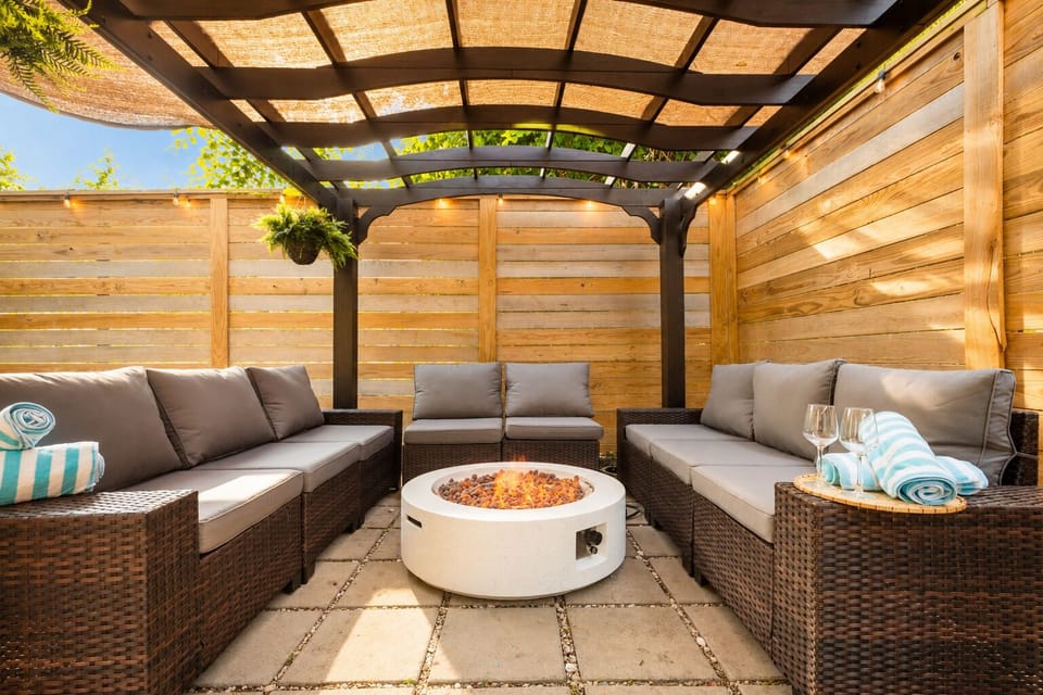 Cozy covered patio with fire pit and private outdoor lounge seating