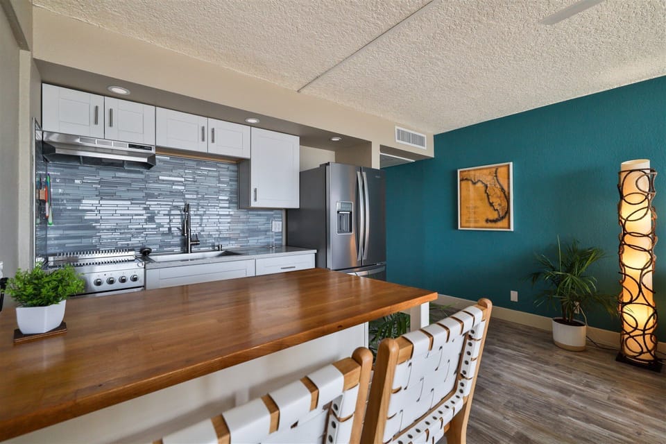 The kitchen island has seating for two and storage prep area 