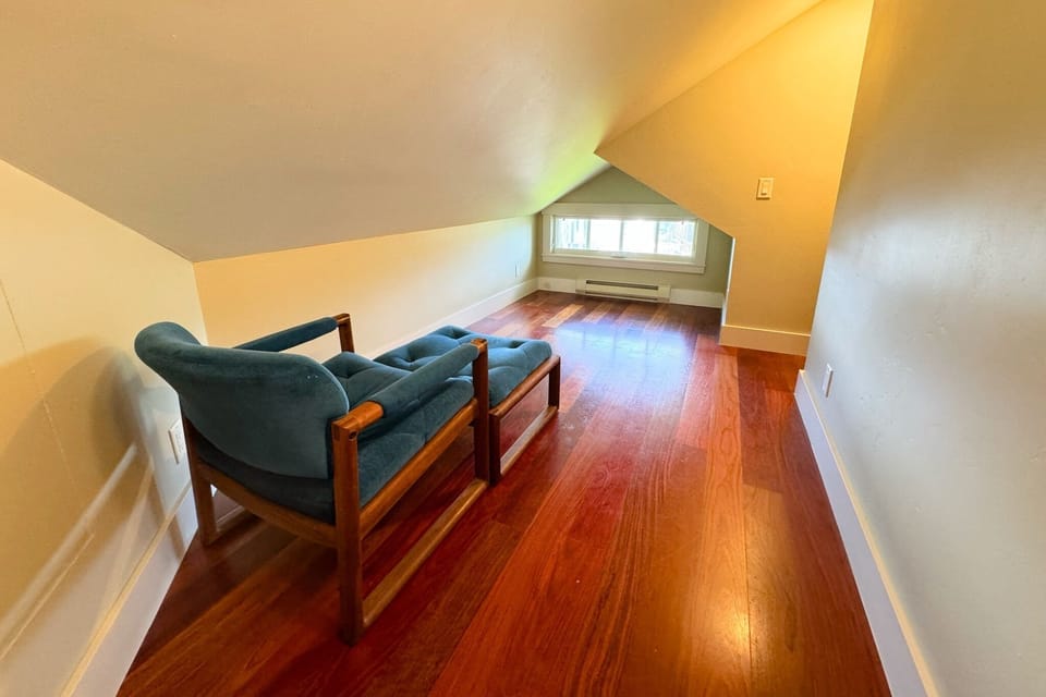 The upstairs reading nook is the perfect spot to sneak away for some quiet time.