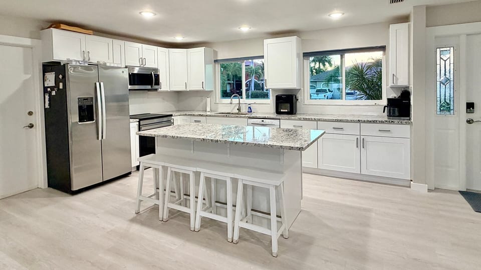 Fully equipped kitchen with granite countertops and induction stovetop