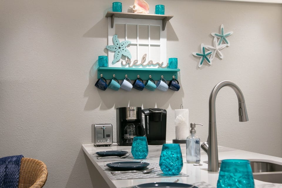 Cups, dishes, utensils are provided along wiith both a Keurig & drip coffee makers!