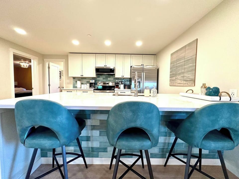 Kitchen island with 3 stools.  Perfect space to chat or play games