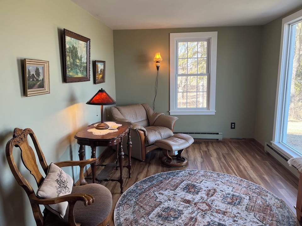 Sitting/reading room. This has a large picture window looking out to the lake.