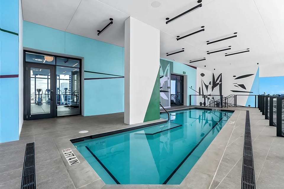 Refresh in the stylish plunge pool with artful mural backdrop.