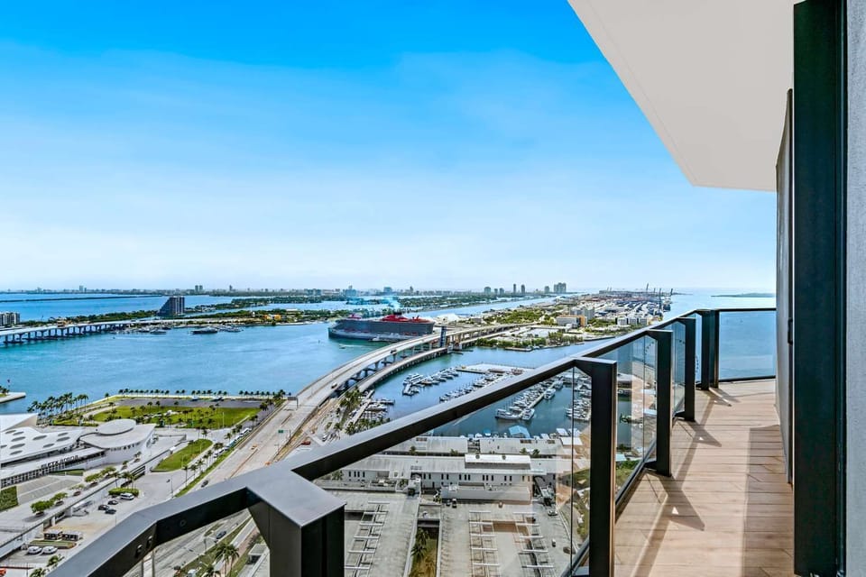 Step outside and feel the city sparkle over the bay.