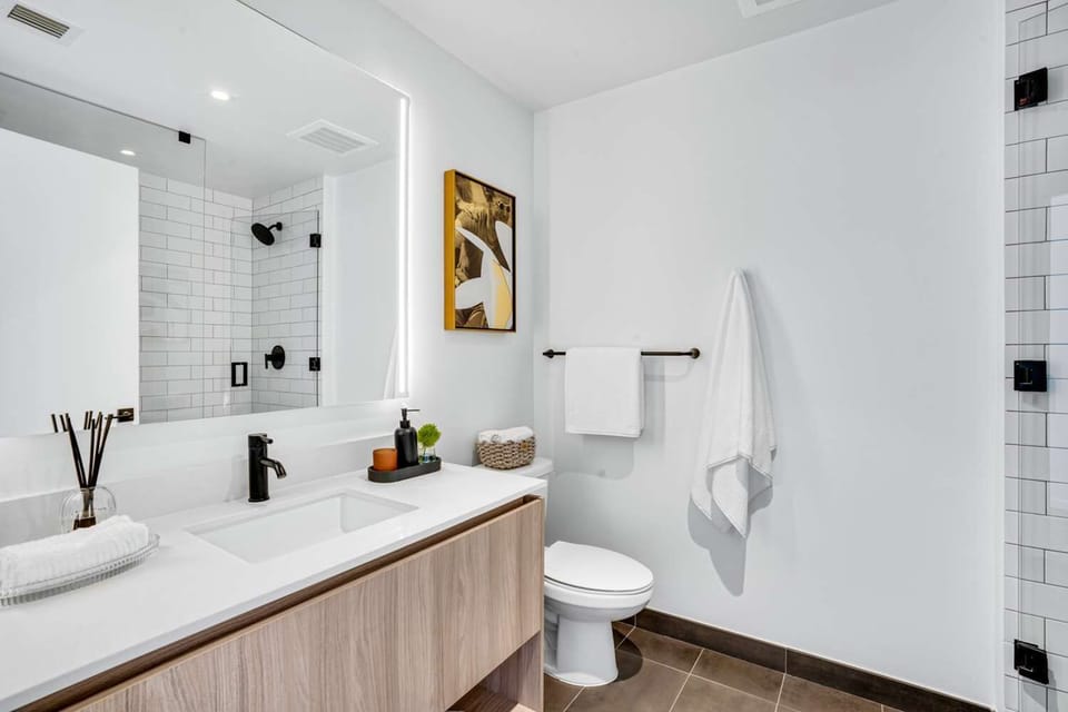Refresh effortlessly with a bright vanity and sleek finishes.