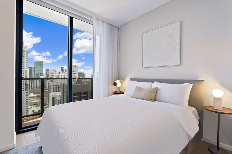 Relax in a serene bedroom with glowing bedside ambiance.