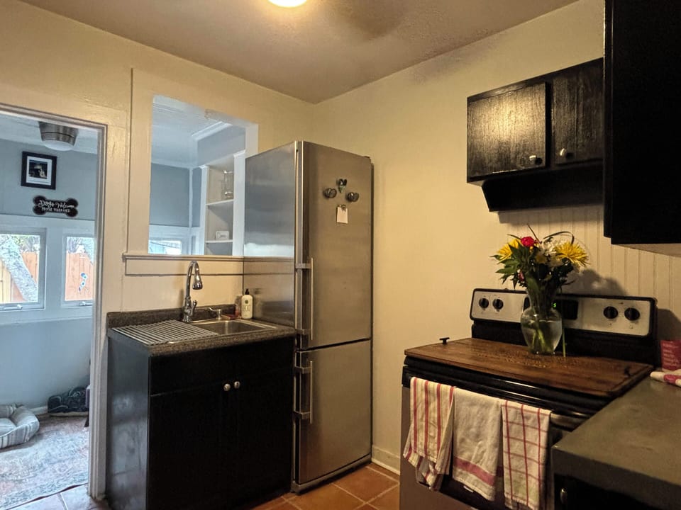 Functional kitchen equipped for cooking - microwave, coffee maker, toaster, too!