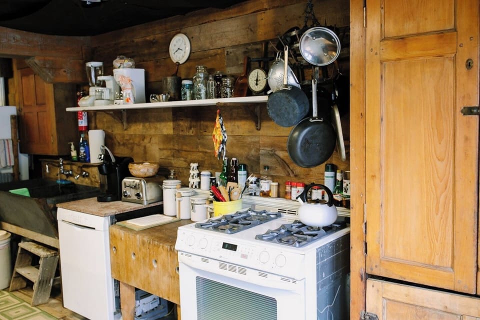Butcher block, gas stove and pantry. 