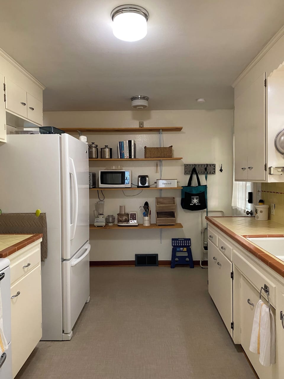 Well appointed kitchen w/ vintage charm leads to an outdoor oasis.