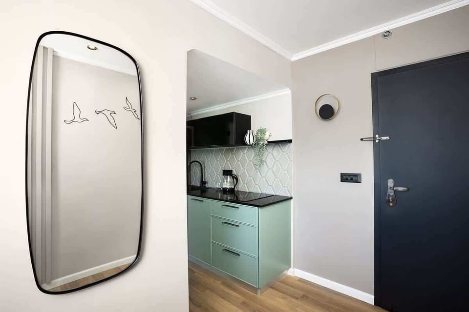 A fully equipped kitchen makes the apartment perfect for both short and long stays. The kitchen features a full-size refrigerator and freezer, an induction stove, a microwave, a Nespresso machine, cooking ware, and more.