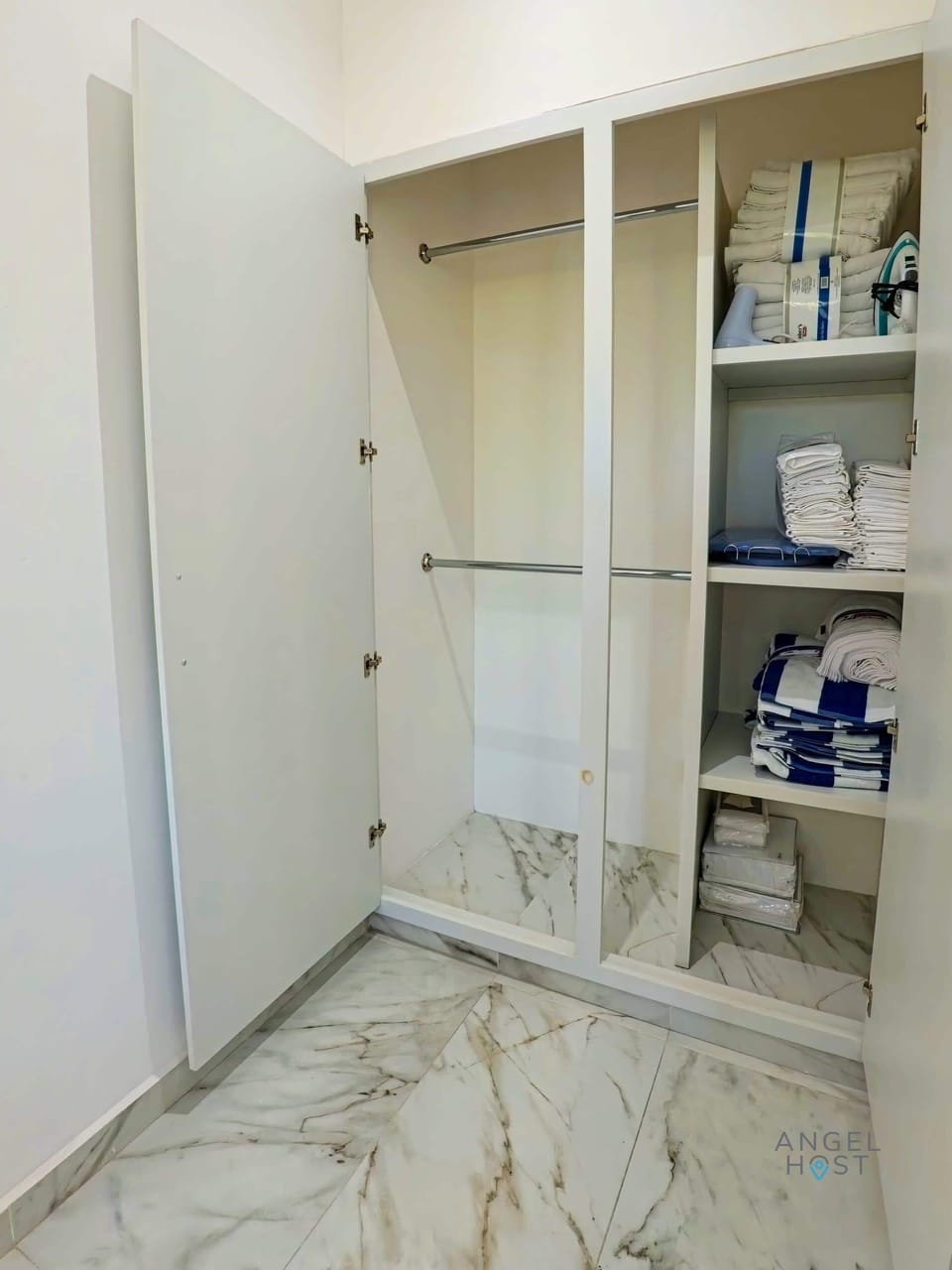 Open closet with shelves and hanging space.