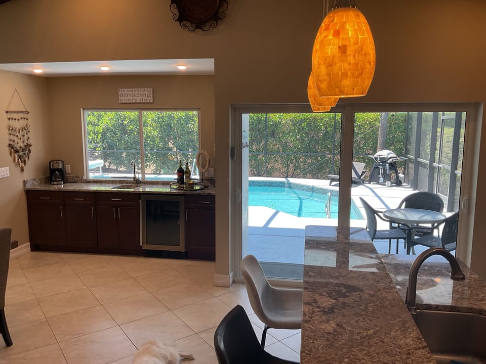 Large bar area that opens to pool and lanai.