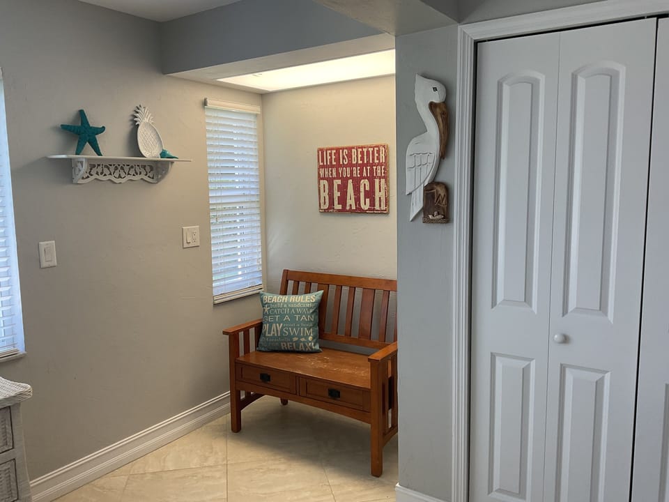 Reading nook in third bedroom filled with light.