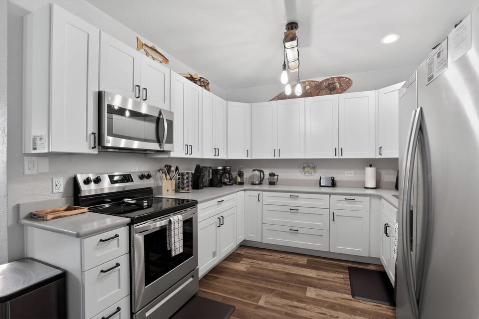 Fully Equipped Kitchen fitted with sharp knives, lots of cooking gadgets and a spice rack.  Coffee corner with several options!  Keurig, Nespresso, French Press, and traditional.
