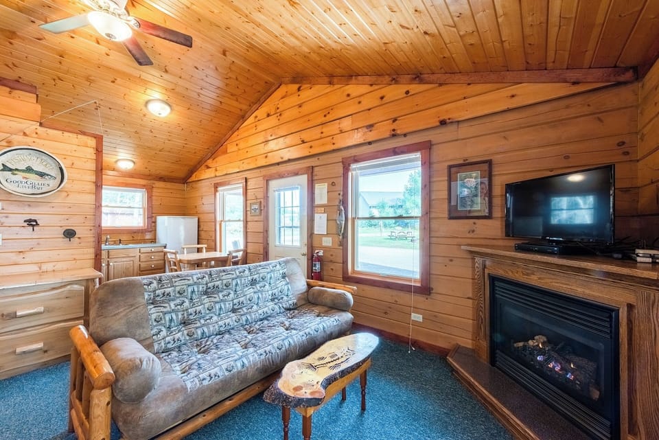 Cedar Cabin Living Space

Enjoy the amenities of home in the quaint 2 bedroom log cabin.  This is a view into the kitchen, big enough to cook & enjoy meals or small enough if you would rather leave the mess to someone else and eat out!    The log cabins on the Ranch all have gas fire places.  They are nice to enjoy watching the fire, but they are also an alternative heat source for the cabin!  