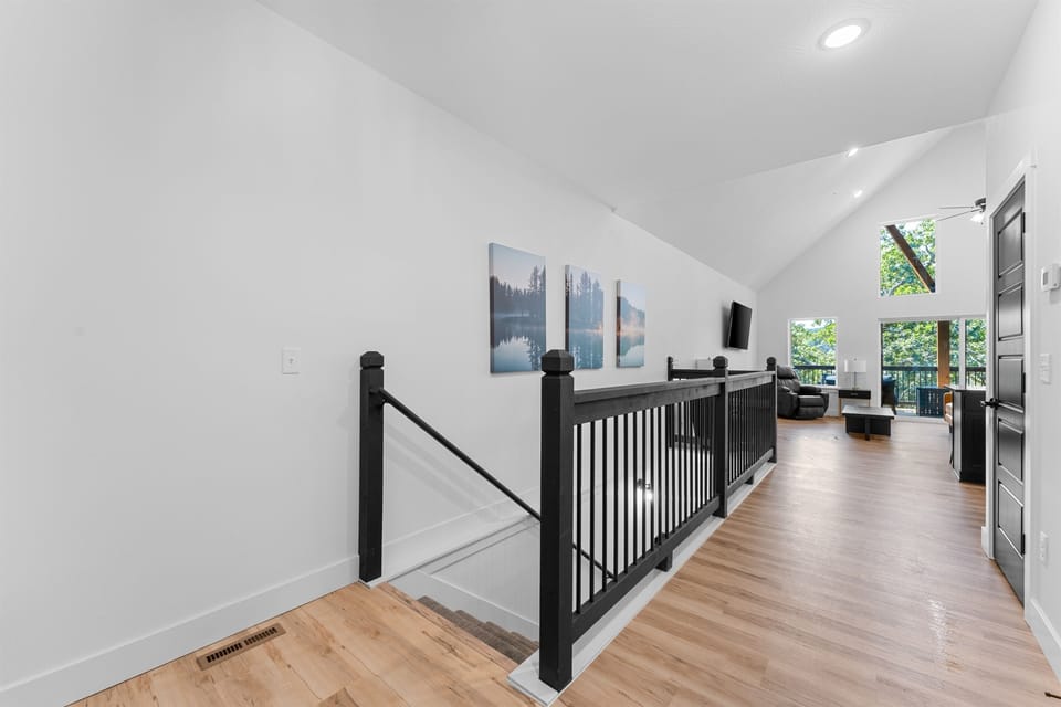 Bright and airy a sleek, modern hallway with a view.